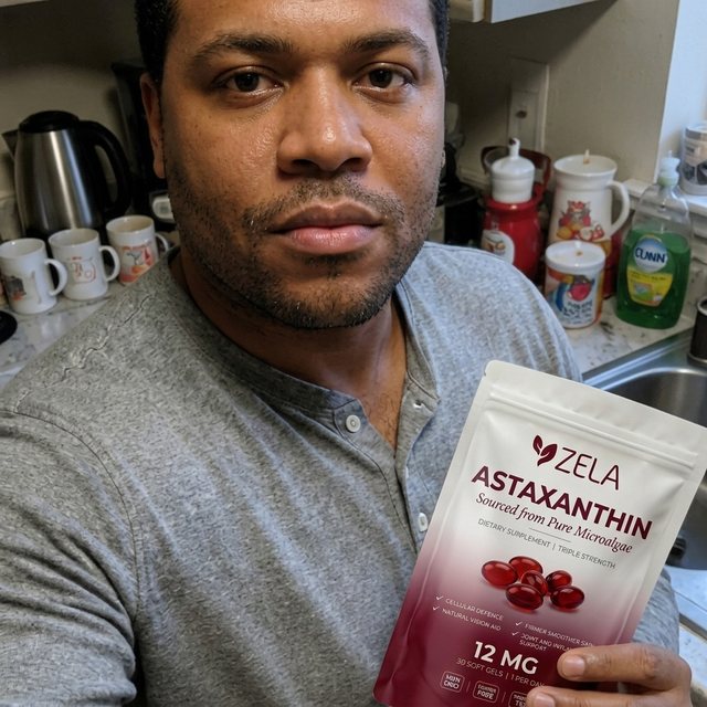 A customer holding a pouch of Zela Astaxanthin